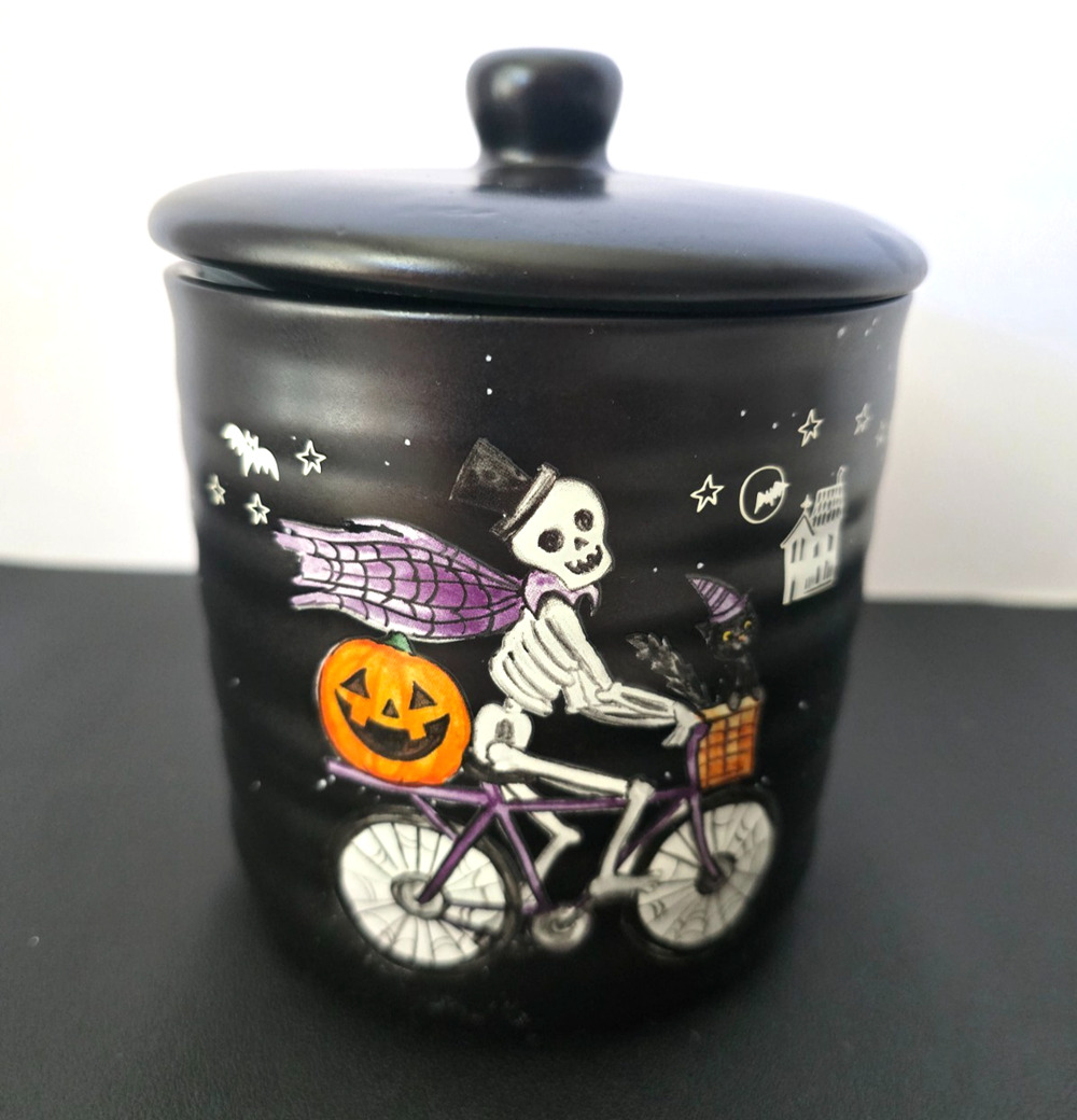 Cobwebs & Cauldrons Skeleton on Bike with Jack-O-Lantern 5 1/2" Canister w/ lid